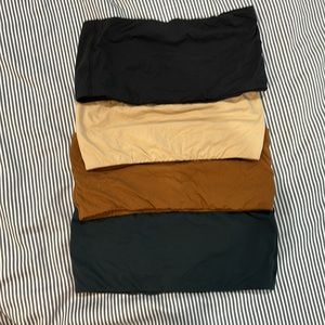 Set of four skims strapless bandeau bralettes in neutrals . Size m